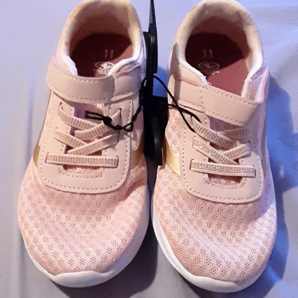 Girls pink laced tennis shoes
